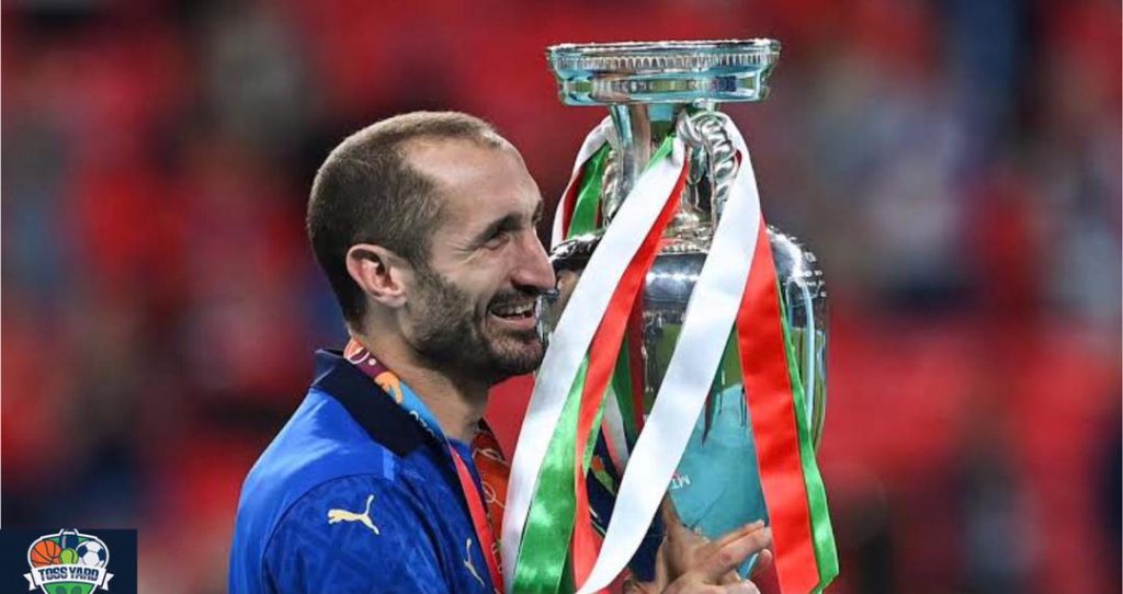 Chiellini holding the Euro 2020 trophy after winning it with Italy