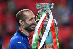 Chiellini holding the Euro 2020 trophy after winning it with Italy