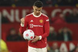 Manchester United's Cristiano Ronaldo punching the ball,