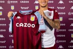 Phillippe Coutinho posting with an aston villa jersey after making his move from Barcelona permanent.
