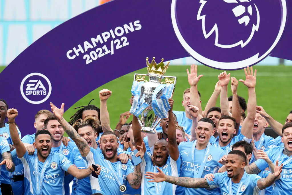 Fernandinho lifting the Premier League trophy with Manchester City after a 3-2 win over Aston Villa on the final day.
