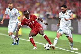 KIEV, UKRAINE - MAY 26: Sadio Mane of Liverpool competes with Isco of Real Madrid during the UEFA Champions League final between Real Madrid and Liverpool at NSC Olimpiyskiy Stadium on May 26, 2018 in Kiev, Ukraine. (Photo by MB Media/Getty Images)