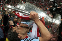 Calos Tevez kissing the UEFA Champions League trophy he won with Manchester United in 2008 in Moscow