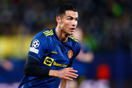 Cristiano Ronaldo running in Manchester United's blue away kit for 2021/22 season.