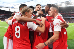 Arsenal players celebrating a goal together at the emirates - 2023