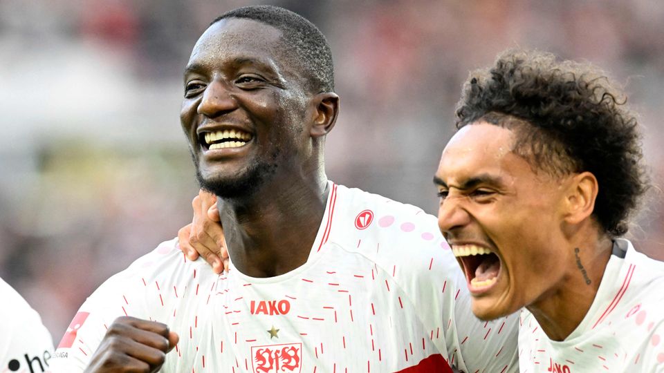 Stuttgart's Guinean forward #09 Serhou Guirassy (L) celebrates with Stuttgart's French midfielder #08 Enzo Millot (R) after he scored the 3-1 goal during the German first division Bundesliga football match between VfB Stuttgart and VfL Wolfsburg in Stuttgart,